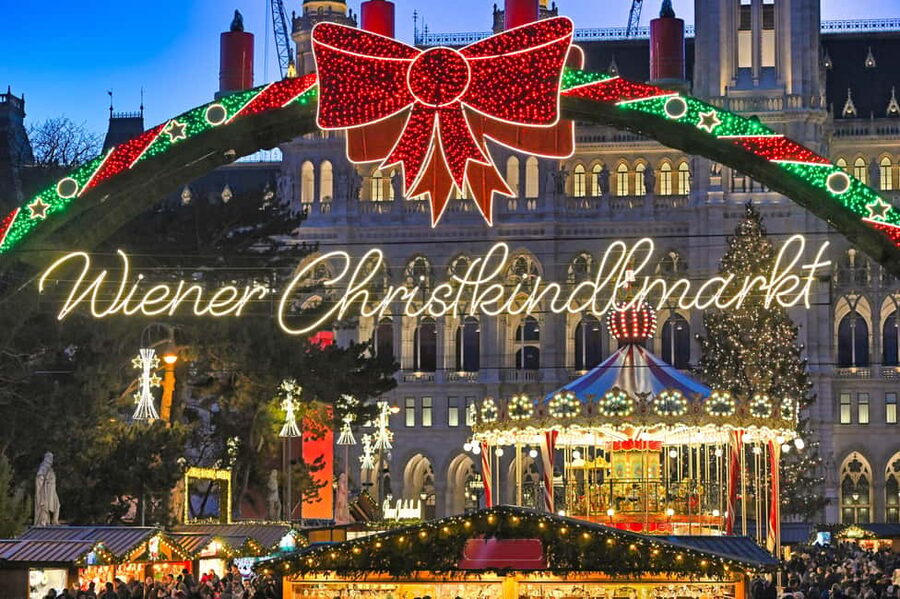 Vienna: Christmas Photoshoot with a Pro Photographer - Burggarten stroll and the Mozart Statue for warm, approachable shots
